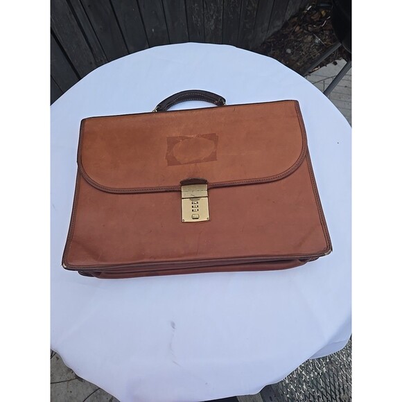 Coach Handbags - Coach Vintage Leather briefcase with gold buckle and two pockets.